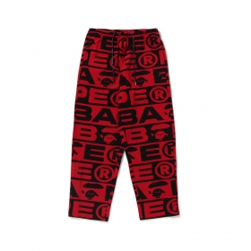 Модные штаны A Bathing Ape красного цвета с черными буквами