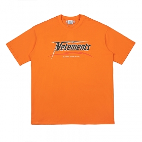 Оверсайз хлопковая футболка VETEMENTS WEAR с принтами бренда оранжевая