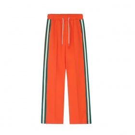 Яркие оранжевые штаны SEVERS с лампасами и высокой талией