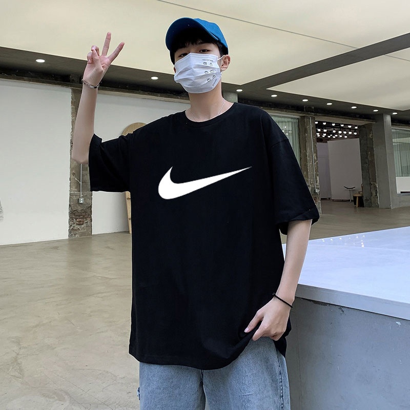 Хлопковая чёрная футболка Nike со спущенной линией плеча