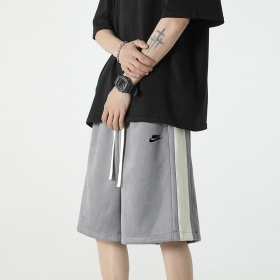 Спортивные серого-цвета удлинённые шорты Nike на резинке