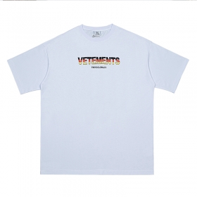 Унисекс белая хлопковая футболка VETEMENTS WEAR с разноцветным принтом