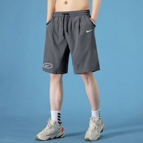 Nike спортивные серые шорты с логотипом выполнены из полиэстера