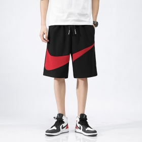 Удлинённые чёрные с красным логотипом Nike шорты на резинке