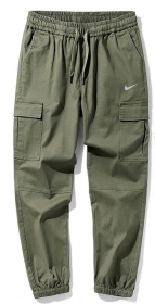 Штаны цвета-хаки от бренда Nike на эластичной резинке со шнурком