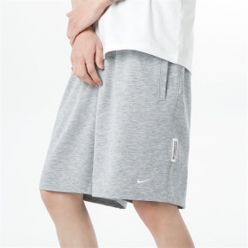Серые шорты с боковыми карманами от бренда Nike с вышитым логотипом