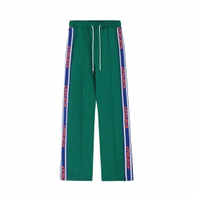 Зеленые штаны от бренда SEVERS с простроченными спереди стрелками