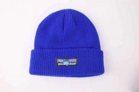 От бренда Patagonia синяя из хлопковая вязаная шапка
