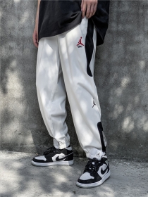 Стильные с кнопками снизу Nike Jordan штаны белого цвета