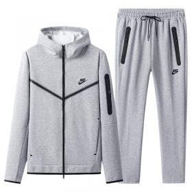 Серый от бренда Nike спортивный костюм с карманами на молнии