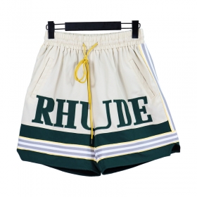 Молочного цвета шорты RHUDE с зелеными вставками и фирменным лого