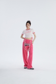 Удобные штаны розового цвета от бренда UNINHIBITEDNESS