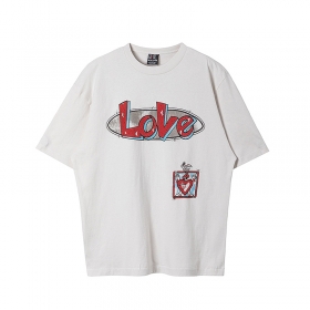 От бренда Saint Michael белая с надписью "Love" футболка