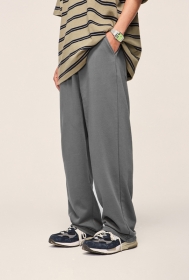 Серые спортивные штаны бренда INFLATION с резинкой на талии
