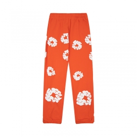 Эксклюзивная модель штанов Denim Tears в оранжевом цвете