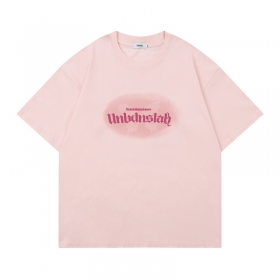 Светло-розовая футболка UNINHIBITEDNESS с брендовым рисунком