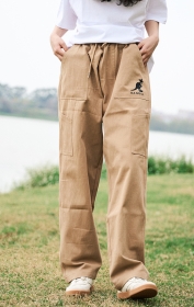 Бежевые однотонные широкие штаны от бренда Kangol с резинкой на талии