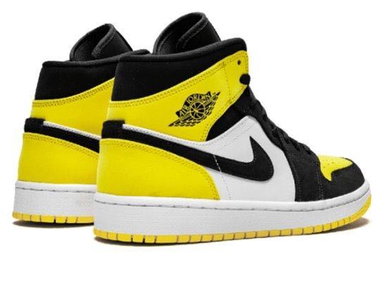 Желтые с черным и белым кроссовки Air Jordan Mid кожа
