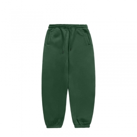 От бренда INFLATION штаны на резинке со шнурком зеленые