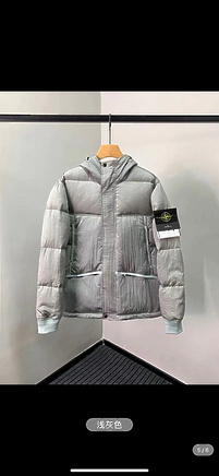 Теплый пуховик Stone Island серый с карманами и логотипом