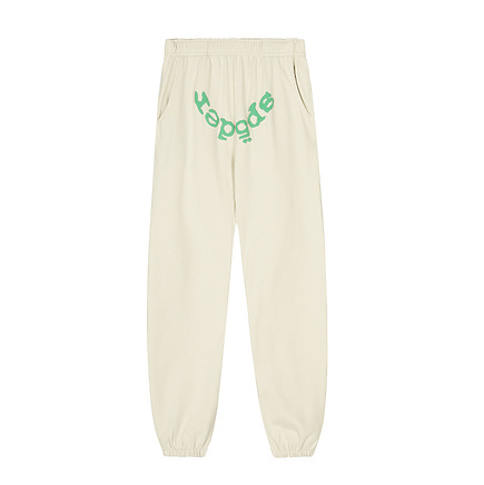 Штаны Sp5der базовые в молочном цвете с надписью бренда