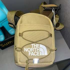 Универсальная бежевая сумка The North Face через плечо с завязками