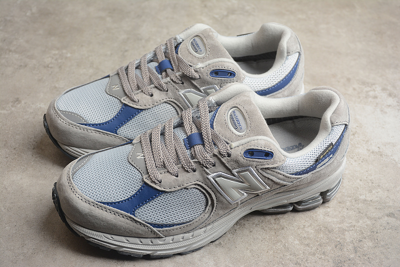 Комбинированные бежевые с синим New Balance NB 2002R кроссовки