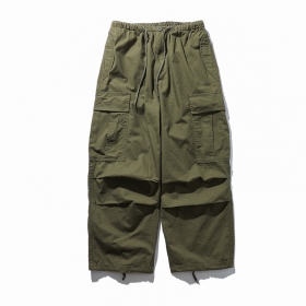 Унисекс зелёные широкие брюки от бренда PMGO с карманами
