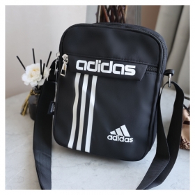 Компактная сумка-барсетка Adidas чёрного цвета с регулируемым ремнём