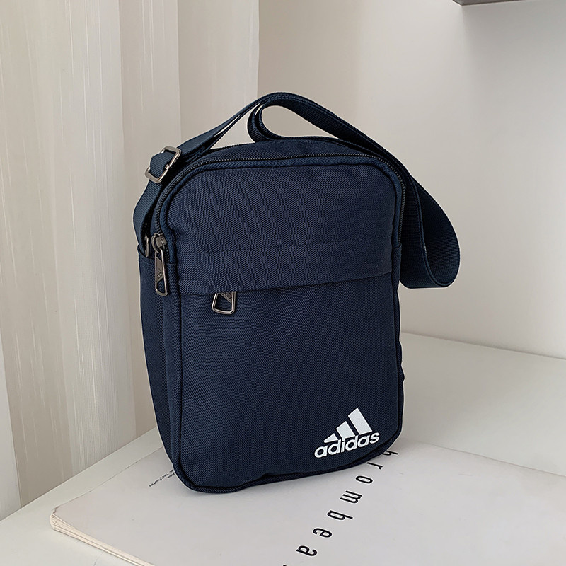 Тёмно-синяя сумка-барсетка Adidas с несколькими карманами