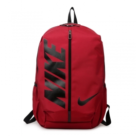 Красный Nike рюкзак с карманами по бокам для занятий спортом