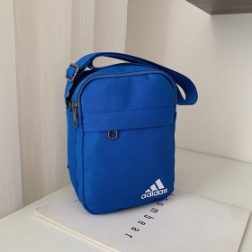 Сумка-барсетка бренда Adidas синего цвета с белым лого