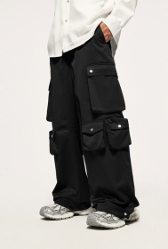 Карго штаны INFLATION черного цвета с большими карманами на кнопках