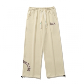 Штаны бежевые TXC Pants с надписями спереди и регулировкой штанины