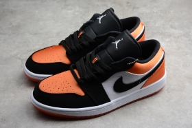 Текстильно-кожаные кеды Nike Air Jordan 1 Low чёрно-оранжевого цвета