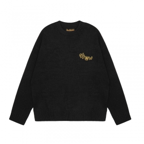 От бренда DREW HOUSE черный свитер с желтым логотипом