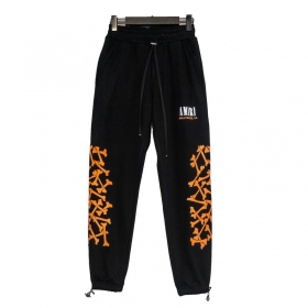 Черные штаны Amiri с брендовым принтом "оранжевые кости"