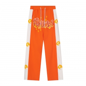 Брендовые оранжевые штаны SEVERS с яркой надписью и вышивкой