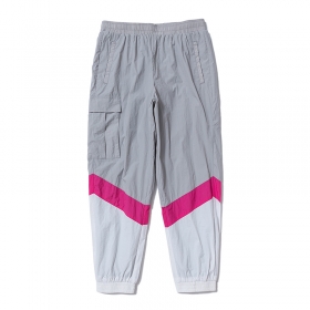 Серо-белые контрастные с розовой полосой штаны от VETEMENTS WEAR