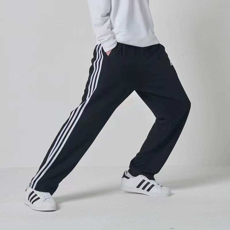 Трикотажные Adidas чёрные спортивные штаны с полосками на резинке