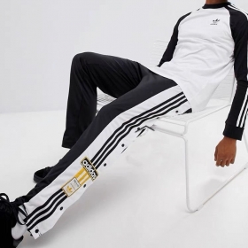 Спортивки чёрно-белые с жёлтой нашивкой с логотипом Adidas