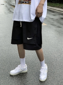 Чёрные широкие с разрезами шорты Nike на резинке с завязками