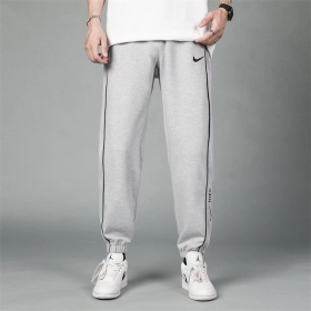 Серые трикотажные Nike спортивные штаны с манжетами