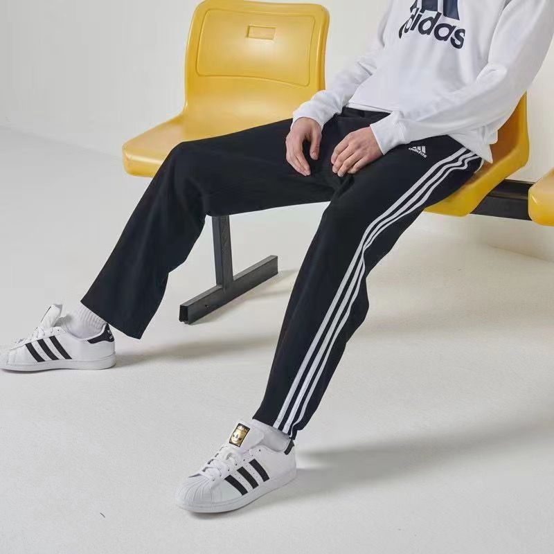 Трикотажные Adidas чёрные спортивные штаны с полосками на резинке