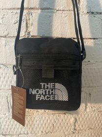 The North Face чёрная сумка-барсетка с сетчатым карманом спереди