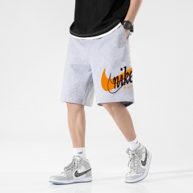 Nike светло-серые шорты по колено выполнены на резинке со шнурком