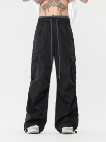 Свободные брюки чёрного цвета от OREETA с накладными карманами