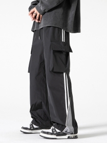 Базовые штаны ACUS выполнены в черном цвете с затяжками снизу