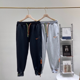 Серые спортивки Nike Swoosh с оранжевым лого
