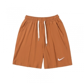 Оранжевые спортивные Nike шорты на плотной резинке